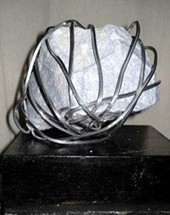 sculpture of stone and metal wire, 2010; Ann Porcelijn