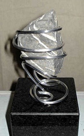 sculpture of stone and metal wire, 2010; Ann Porcelijn