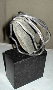 sculpture of stone and metal wire, 2010; Ann Porcelijn